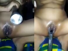 Horny girl fucks in her pussy by torchlight MMS